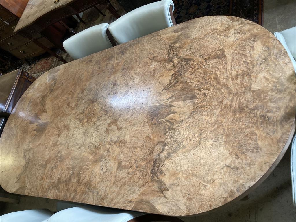 An Art Deco burr walnut dining table, width 214cm, depth 99cm, height 76cm together with four chairs